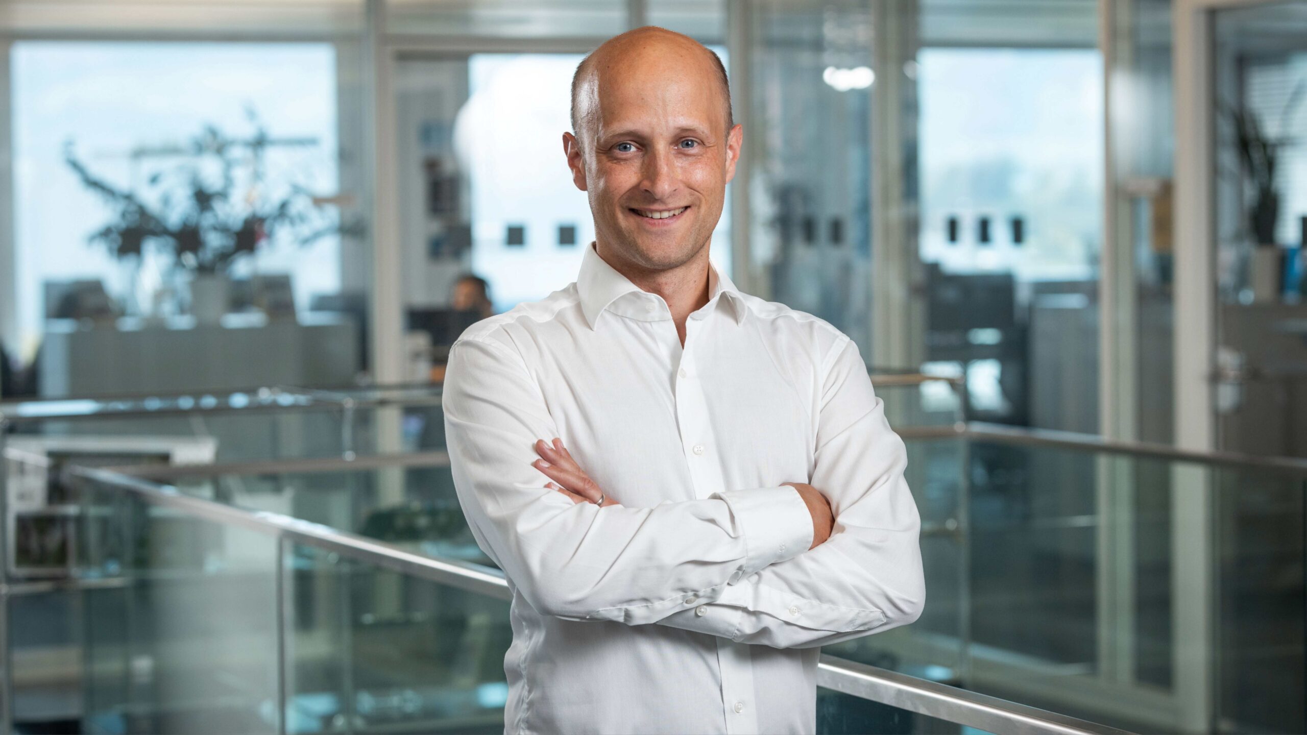 Box Build process at Variosystems: A technician carefully inserts a circuit board into a dedicated assembly station.